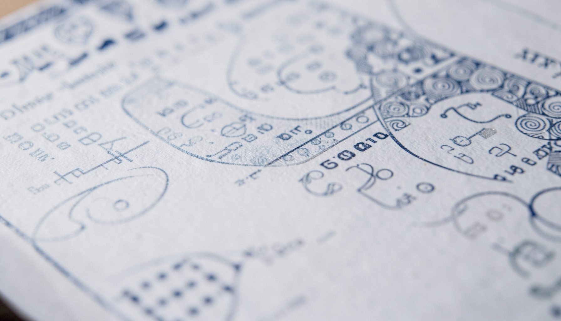 Close-up of a document with a subtle security watermark pattern in navy and silver tones